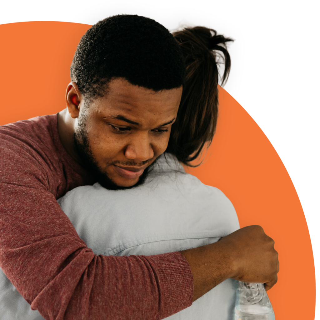 Photo of a man and woman hugging. 