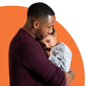 Photo of a man and woman hugging. 